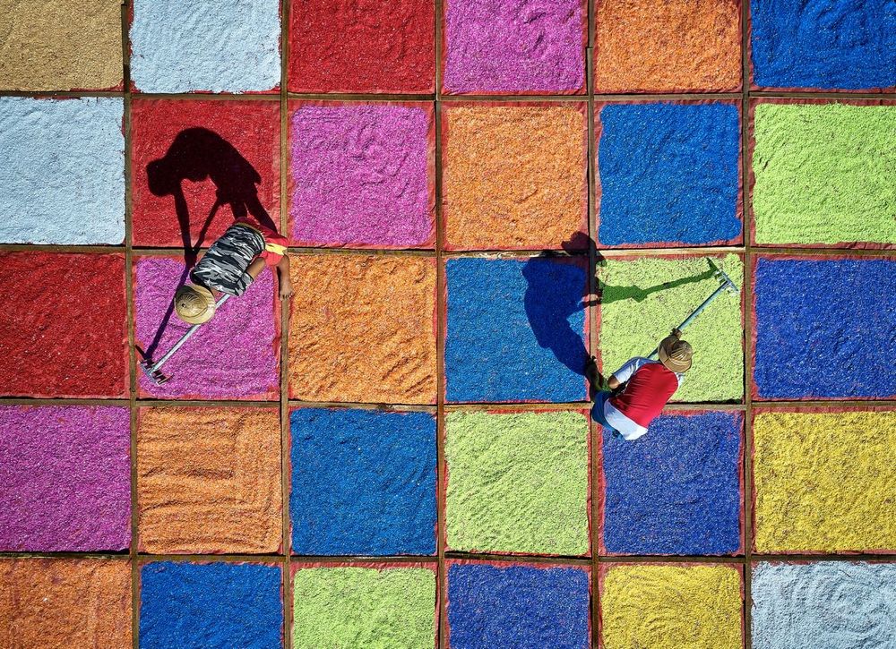 MEN AND COLORFUL PLASTIC SEEDS, YANGON, MYANMAR